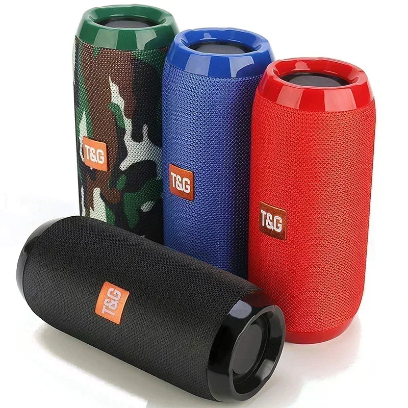 Four colorful TSG portable speakers in different designs on a white background
