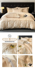Beige bedding set with decorative patterns on a bed, featuring a brand logo.