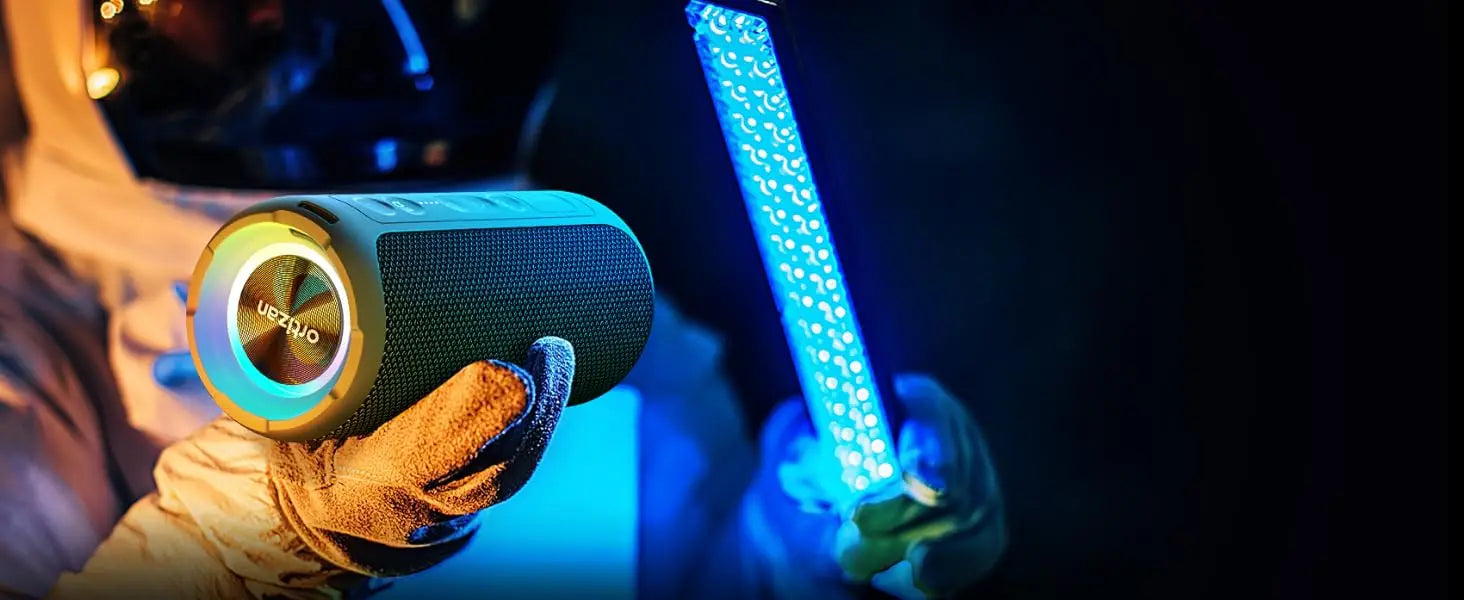 erson holding a cylindrical device with a blue light bar in the background