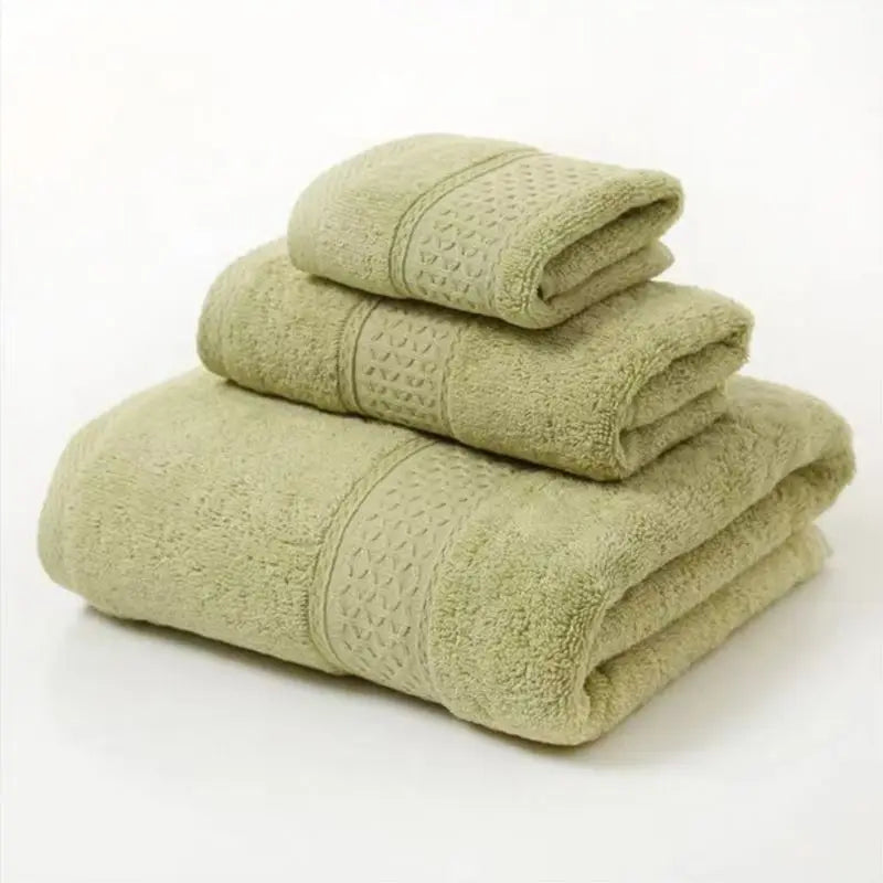 Stack of green towels on a white background