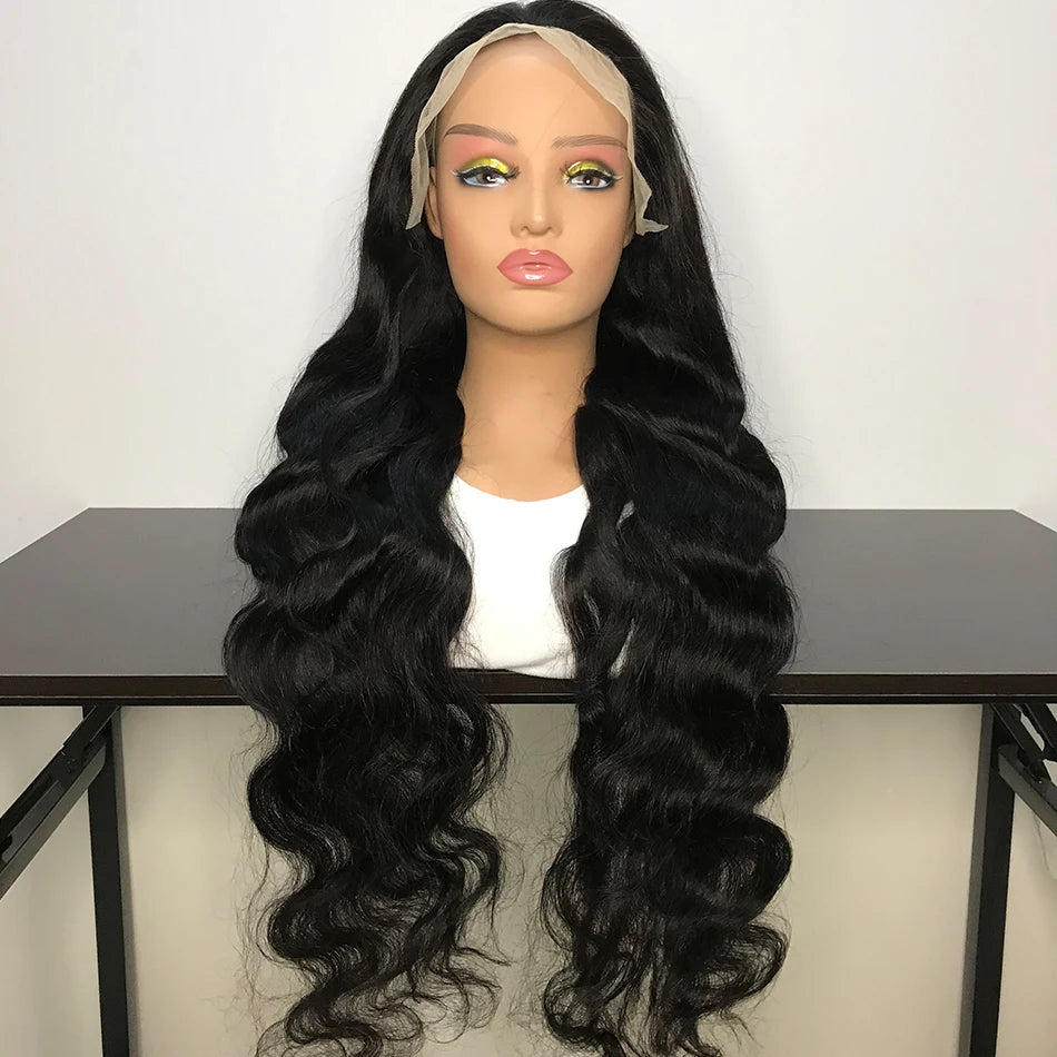 Black wavy wig on a mannequin head with a white background