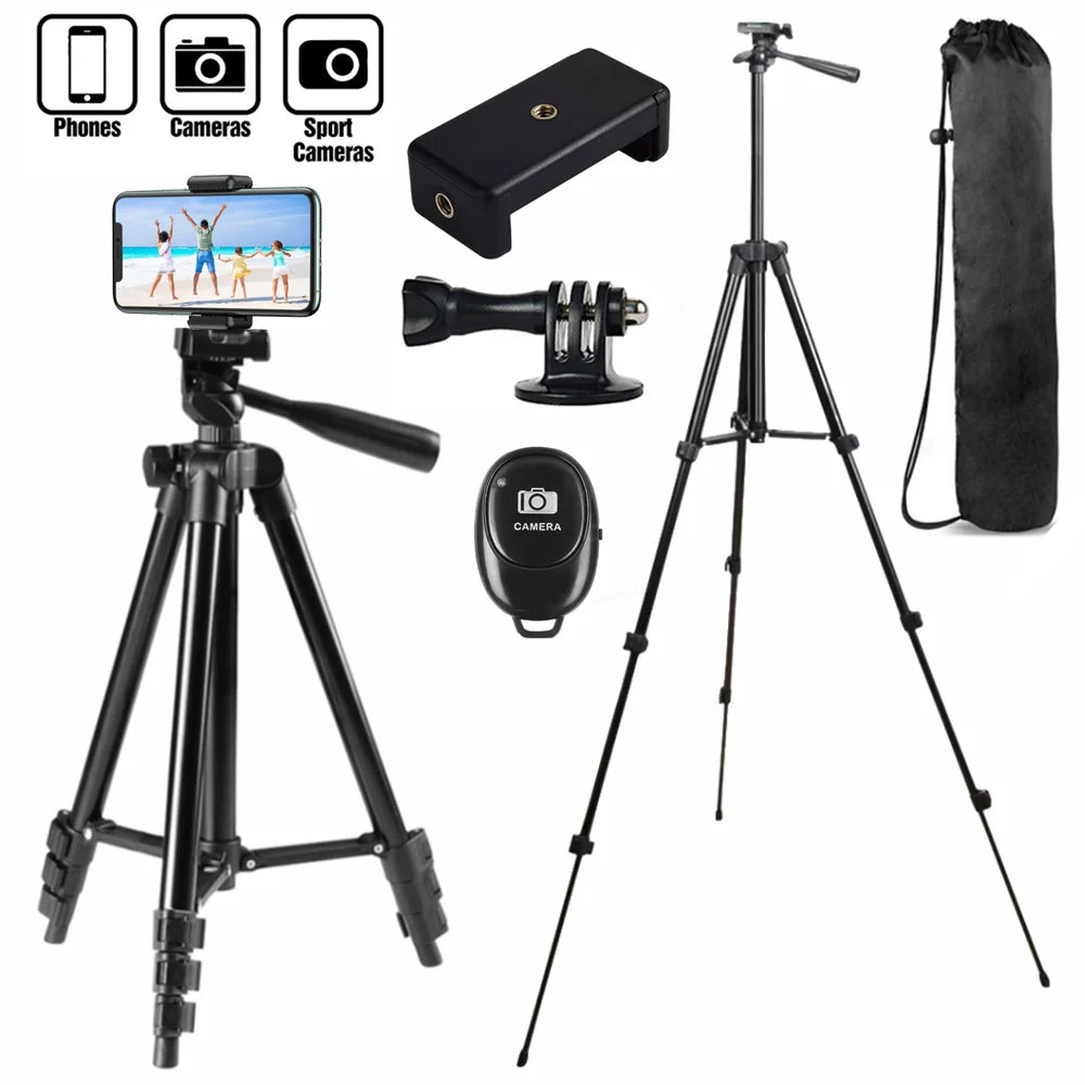 Black camera tripod with accessories on a white background