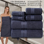 Set of navy blue towels including washcloths, hand towels, and bath towels with a woman holding a towel.
