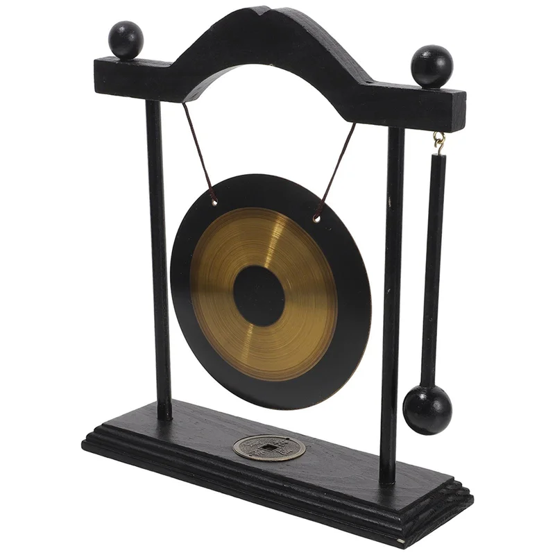 Decorative gong on a stand with black frame and gold center