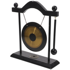 Decorative gong on a stand with black frame and gold center