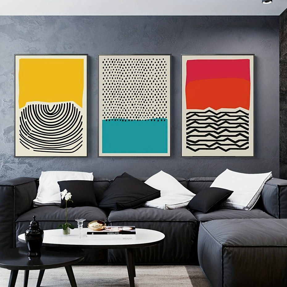 Modern living room with a gray sofa, coffee table, and colorful abstract art on the wall.